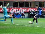 Inter Milan's Marko Livaja slots the ball past Neftci goalkeeper Sasa Stamenkovic on December 6, 2012
