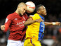 Nottingham Forest's Henri Lansbury and Crystal Palace's Kagisho Dikgacoi battle for the ball on December 29, 2012