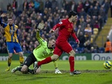 Mansfield players protest Luis Suarez's controversial goal for Liverpool on January 6, 2013
