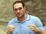 Tyson Fury poses for photos after a press conference on March 7, 2013