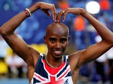 Mo Farah celebrates after winning gold in the Men's 10000 metres final at the World Athletics Championships in Moscow on August 10, 2013