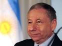 The president of the International Automobile Federation, Jean Todt, arrives for a press conference at the Argentine Automobile Club on August 1, 2013