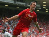 Liverpool's English midfielder Jordan Henderson celebrates scoring his goal during the pre-season friendly football match between Liverpool and Olympiakos at Anfield Stadium in Liverpool, northwest England on August 3, 2013