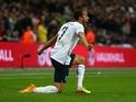 Andros Townsend of England celebrates scoring their third goal during the FIFA 2014 World Cup Qualifying Group H match between England and Montenegro at Wembley Stadium on October 11, 2013