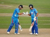 Rohit Sharma (L) and Virat Kohli (R) of India bump fists during the one day tour match between Sussex and India at The County Ground on August 25, 2011