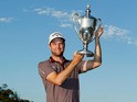 Chris Kirk poses with the trophy after winning The McGladrey Classic at Sea Island's Seaside Course on November 10, 2013