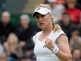 Elena Baltacha of Great Britain reacts during the Ladies Singles match against Flavia Pennetta of Italy on day one of the Wimbledon Lawn Tennis Championships at the All England Lawn Tennis and Croquet Club on June 24, 2013 