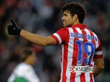 Atletico Madrid's Brazilian forward Diego da Silva Costa gives the thumbs up after scoring during the Spanish league football match Elche vs Club Atletico de Madrid at the Manuel Martinez Valero Stadium in Elche on November 30, 2013