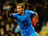 Tottenham's Lewis Holtby celebrates after scoring his team's second goal against Fulham during their Premier League match on December 4, 2013