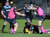 Leone Nakarawa of Glasgow is tackled by Sam Hobbs of Cardiff and Gareth Davies of Cardiff during the The Heineken Cup Pool 2 Match between Glasgow Warriors and Cardiff Blues at Scotstoun Stadium, on December 13, 2013