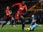 Manchester United's English striker Danny Welbeck scores the opening goal past Norwich City's English goalkeeper John Ruddy (R) during the English Premier League football match on December 28, 2013