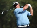 George Coetzee of South Africa plays his second shot on the ninth hole during the second round of the Commercial Bank Qatar Masters at Doha Golf Club on January 23, 2014
