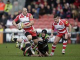 Mike Tindall of Gloucester is tackled during the Aviva Premiership match between Gloucester and Harlequins at the Kingsholm Stadium on February 22, 2014