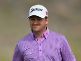 Graeme McDowell of Northern Ireland ponders a shot during the first round of the World Golf Championships - Accenture Match Play Championship at The Golf Club at Dove Mountain on February 19, 2014