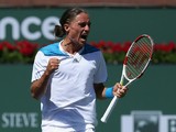 Alexandr Dolgopolov of the Ukraine celebrates his victory over Fabio Fognini of Italy during the BNP Paribas Open at Indian Wells Tennis Garden on March 12, 2014