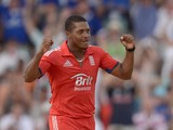 Chris Jordan of England celebrates after dismissing Johnson Charles of the West Indies during the 3rd T20 International match between the West Indies and England at Kensington Oval on March 13, 2014