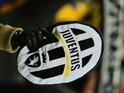 A Juventus supporter waves their logo during the Italian Serie A football match between Juventus and Fiorentina at the Juventus Stadium in Turin on February 9, 2013