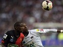 Rennes' Abdoulaye Doucoure and Guingamp's Steeven Langil in action during the French Cup final on May 3, 2014