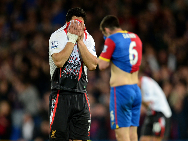 A dejected Luis Suarez of Liverpool reacts following his team's 3-3 draw during the Barclays Premier League match between Crystal Palace and Liverpool at Selhurst Park on May 5, 2014