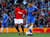 Charni Ekangamene of Manchester United in action with Lewis Baker of Chelsea during the Barclays Under-21 Premier League Final match between Manchester United and Chelsea at Old Trafford on May 14, 2014