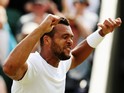 Jo-Wilfried Tsonga of France celebrates after winning his Gentlemen's Singles second round match against Sam Querrey of the United States on day four of the Wimbledon Lawn Tennis Championships at the All England Lawn Tennis and Croquet Club at Wimbledon o