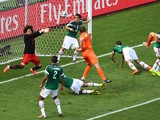 Goalkeeper Guillermo Ochoa of Mexico makes a save after a shot at goal by Stefan de Vrij of the Netherlands during the 2014 FIFA World Cup Brazil Round of 16 match between Netherlands and Mexico at Castelao on June 29, 2014