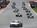 The safety car leads the field following a re-start during the British Formula One Grand Prix at Silverstone Circuit on July 6, 2014