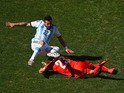 Ezequiel Lavezzi of Argentina is challenged during the World Cup round of 16 match against Switzerland in Sao Paulo on July 1, 2014