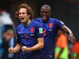 Daley Blind of the Netherlands (L) celebrates scoring his team's second goal against Brazil with teammate Bruno Martins Indi during the 2014 FIFA World Cup 3rd Place Playoff on July 12, 2014