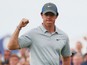 Rory McIlroy of Northern Ireland celebrates holing an eagle putt on the 16th green during the third round of The 143rd Open Championship at Royal Liverpool on July 19, 2014