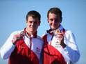 Brothers Alistair and Jonathan Brownlee with their gold and silver triathlon medals on July 24, 2014