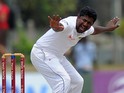Sri Lankan cricketer Rangana Herath unsuccessfully appeals for a Leg Before Wicket (LBW) decision against unseen South Africa cricketer AB de Villiers during the fourth day of the opening Test match between Sri Lanka and South Africa at the Galle Internat