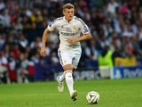 Real Madrids German midfielder Toni Kroos runs with the ball during the UEFA Super Cup football match between Real Madrid and Sevilla at Cardiff City Stadium in Cardiff, south Wales on August 12, 2014