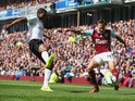 Antonio Valencia of Manchester United goes into to block Matthew Taylor of Burnley during the Barclays Premier League match between Burnley and Manchester United at Turf Moor on August 30, 2014