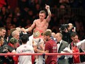 Britain's Carl Frampton celebrates after defeating Spain's Kiko Martinez during an IBF super-bantamweight title boxing match in Belfast's Titanic Quarter in Northern Ireland, on September 6, 2014
