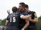 Ernst Joubert of Saracens celebrates scoring a try with Alex Goode during the Aviva Premiership match between Saracens and Sale Sharks at Allianz Park on September 27, 2014
