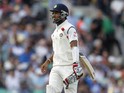 Indias Cheteshwar Pujara walks back to the pavilion after losing his wicket for 11 runs during play on the third day of the fifth cricket Test match between England and India at The Oval in London on August 17, 2014