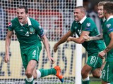 Republic of Ireland's defender John O'Shea celebrates scoring the last minute equalizer with his team-mates during the UEFA Euro 2016 Group D qualifying football match Germany vs Republic of Ireland in Gelsenkirchen, western Germany on October 14, 2014