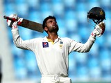 Ahmed Shehzad of Pakistan celebrates as he reaches his century during day four of the First Test between Pakistan and Australia at Dubai International Stadium at Dubai International Stadium on October 25, 2014