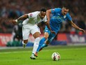 Nathaniel Clyne of England battles with Andraz Kirm of Slovenia during the EURO 2016 Qualifier Group E match between England and Slovenia on November 15, 2014