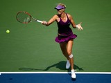 Mirjana Lucic-Baroni of Croatia returns a shot to Sara Errani of Italy during their women's singles fourth round match on Day Seven of the 2014 US Open on November 19, 2014