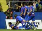 Levante's players celebrate after scoring during the Spanish league football match Levante UD vs Valencia CF at the Ciutat de Valencia stadium in Valencia on November 23, 2014.