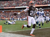 Justin Gilbert #21 of the Cleveland Browns returns an interception for a touchdown during the third quarter against the Indianapolis Colts at FirstEnergy Stadium on December 7, 2014