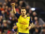 Mathieu Debuchy of Arsenal celebrates scoring his goal during the Barclays Premier League match between Liverpool and Arsenal at Anfield on December 21, 2014