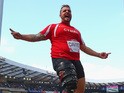 Aled Davies of Wales celebrates as he competes in the Men's F42/44 Discus final at Hampden Park Stadium on July 28, 2014