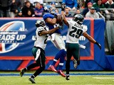 Rueben Randle #82 of the New York Giants makes a catch in the first quarter as Nolan Carroll #23 and Nate Allen #29 of the Philadelphia Eagles defend during a game at MetLife Stadium on December 28, 2014