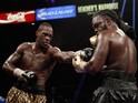Deontay Wilder (L) connects on WBC heavyweight champion Bermane Stiverne during their title fight at the MGM Grand Garden Arena on January 17, 2015