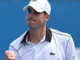 John Isner celebrates victory in the first round of the Australian Open on January 20, 2015