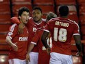 Britt Assombalonga of Nottingham Forest is congratulated after scoring the opening goal during the Sky Bet Championship match against Wigan on February 11, 2015