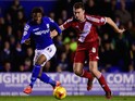 Birmingham forward Demarai Gray (l) is challenged by Middlesbrough defender Ben Gibson during the Sky Bet Championship match on February 18, 2015